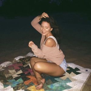 V-neck, scoop back sweater.